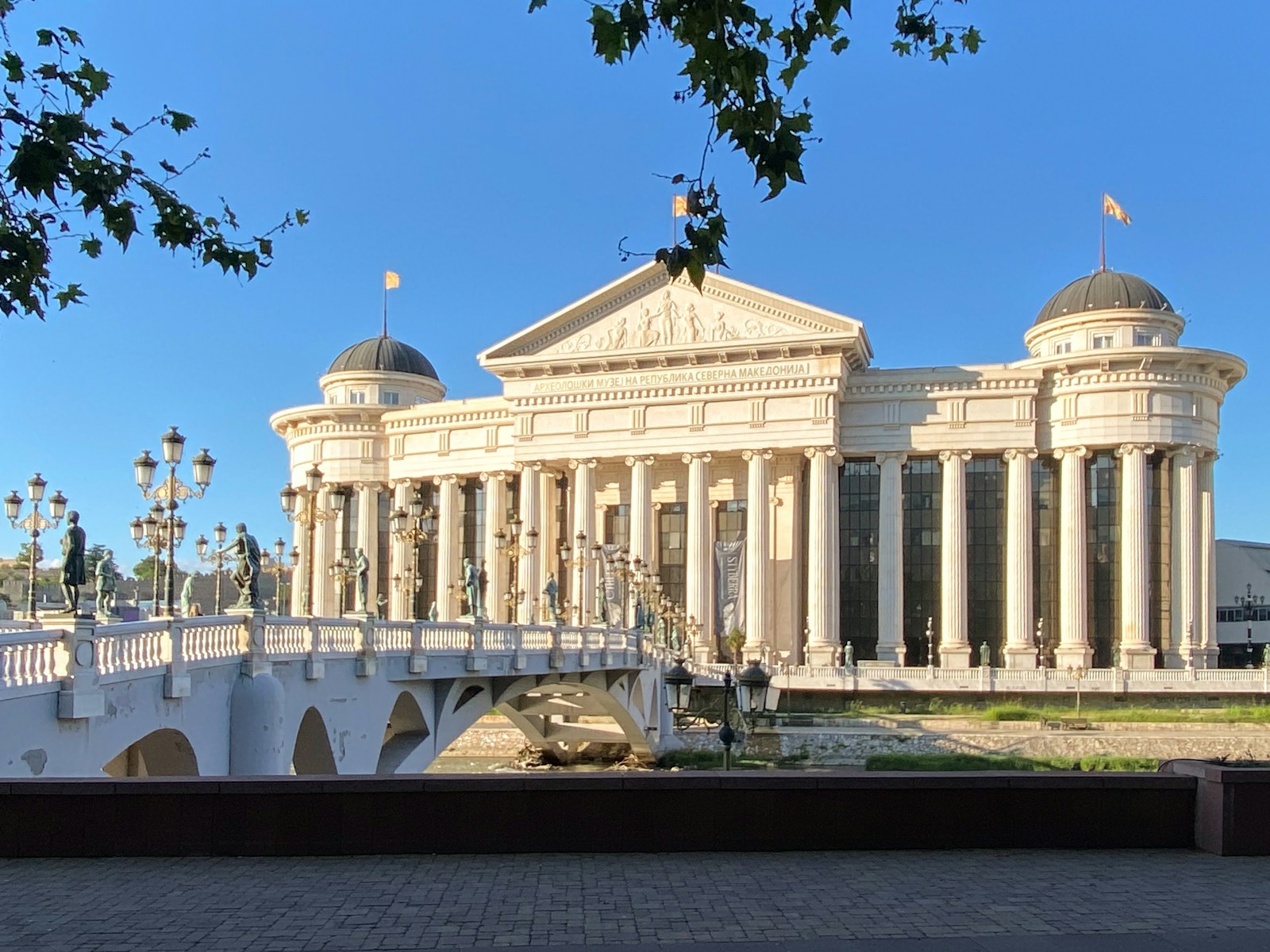 a white building with a white bridge in front of it